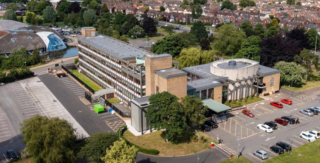 Aerial view of the UCNL building on a sunny day